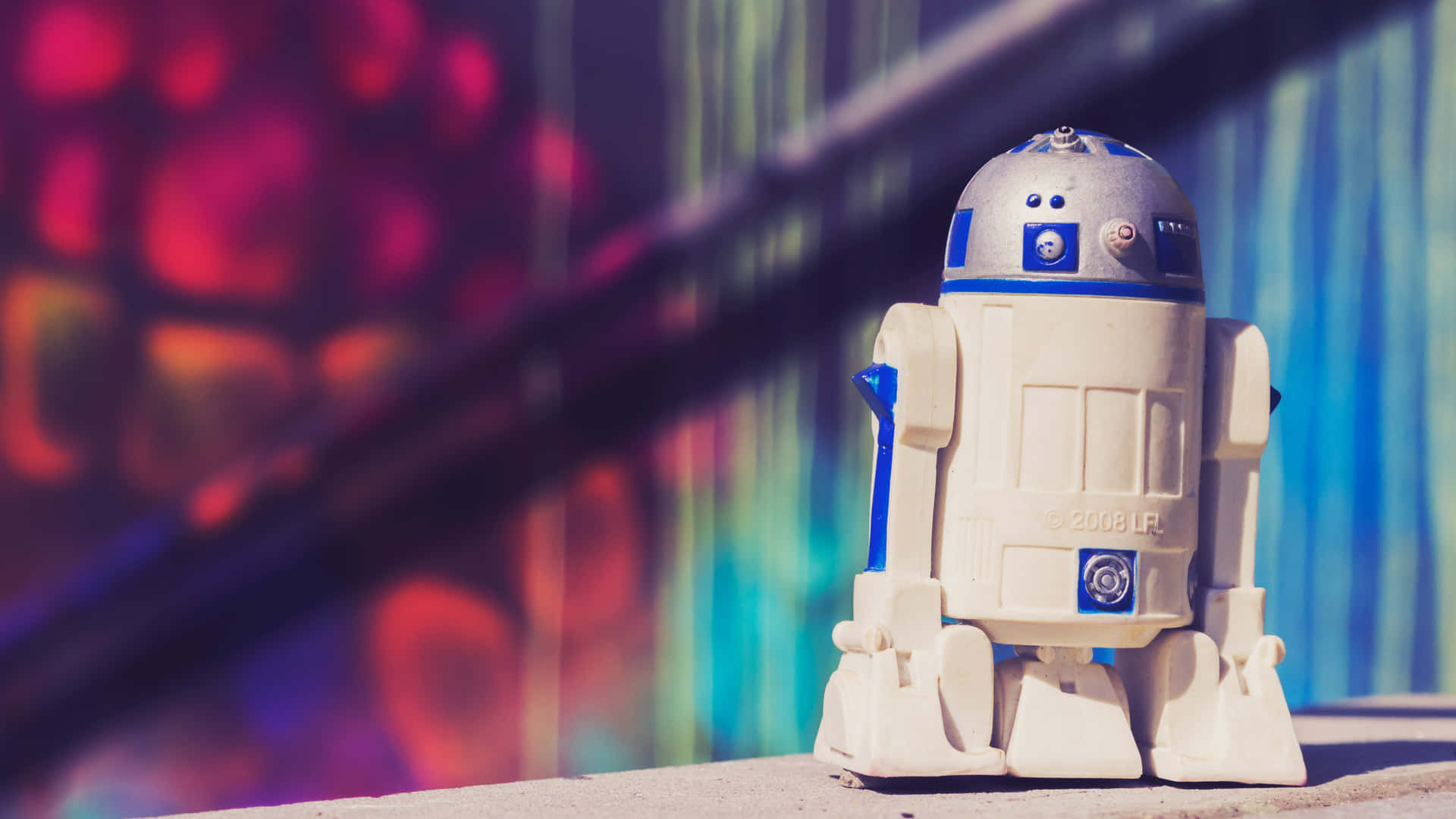 R2-D2, den elskværdige droid fra Star Wars, pryder disse tapet. Wallpaper