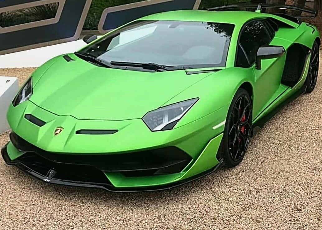 A Green Lamborghini Parked In Front Of A Building