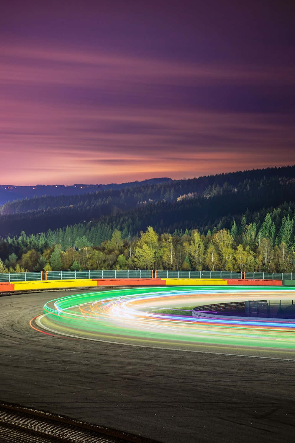 A Race Track With Light Trails At Night