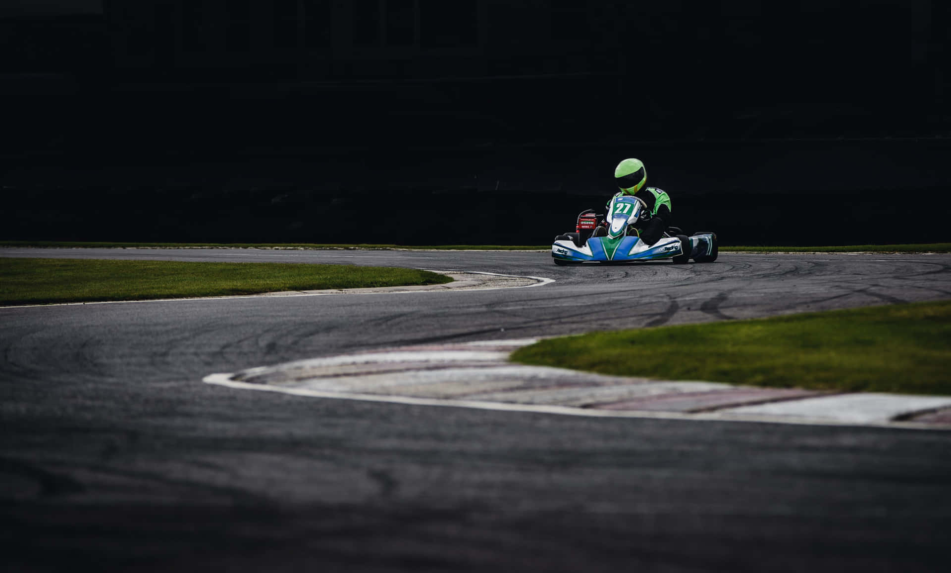 A Person Driving A Go Kart On A Track