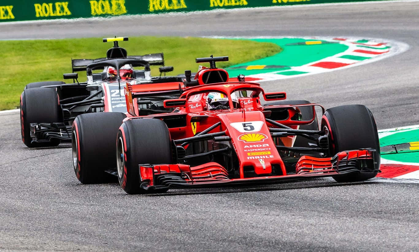 Two Ferrari Racing Cars On A Track