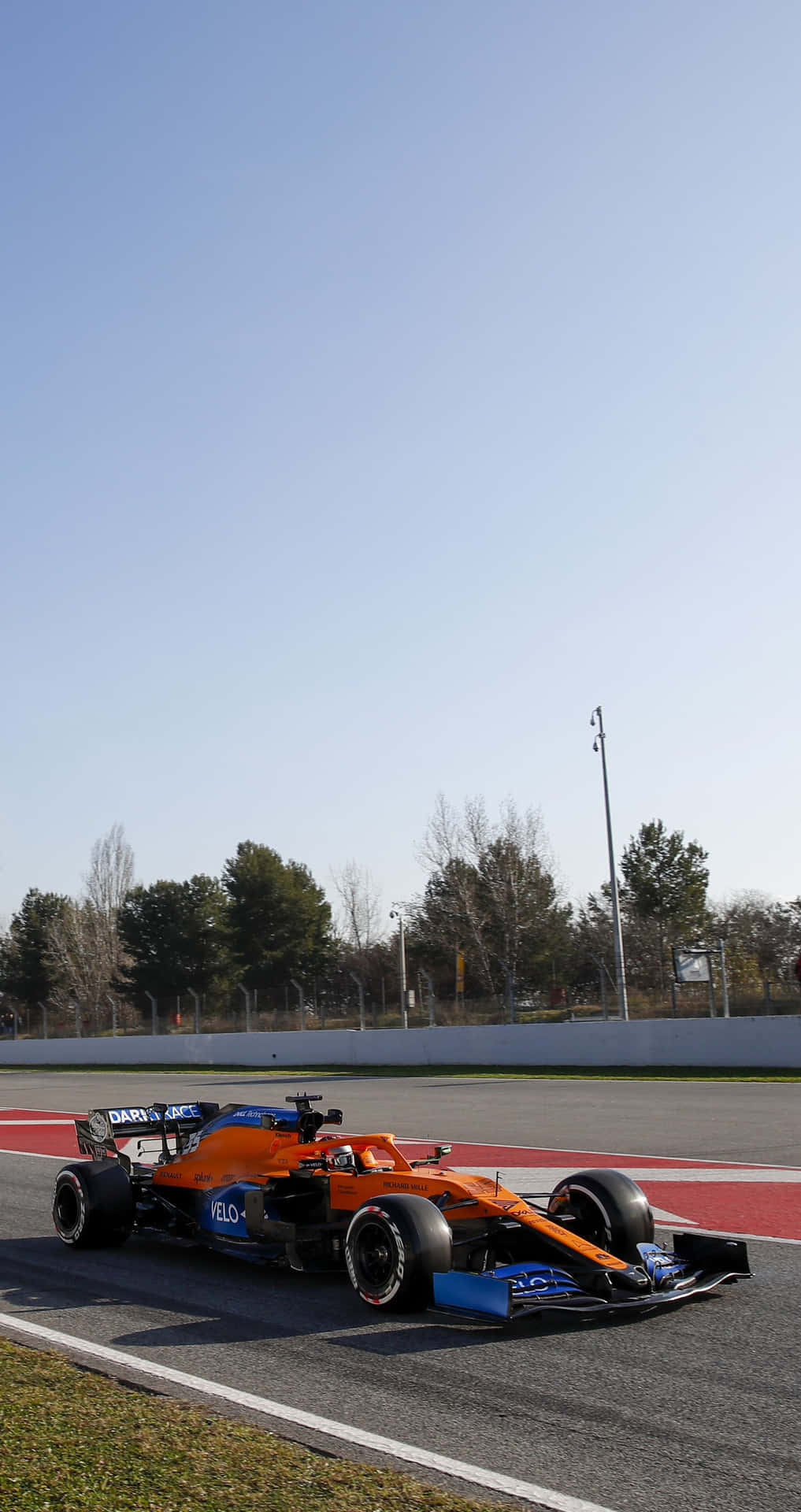 A Blue And Orange Racing Car On A Track