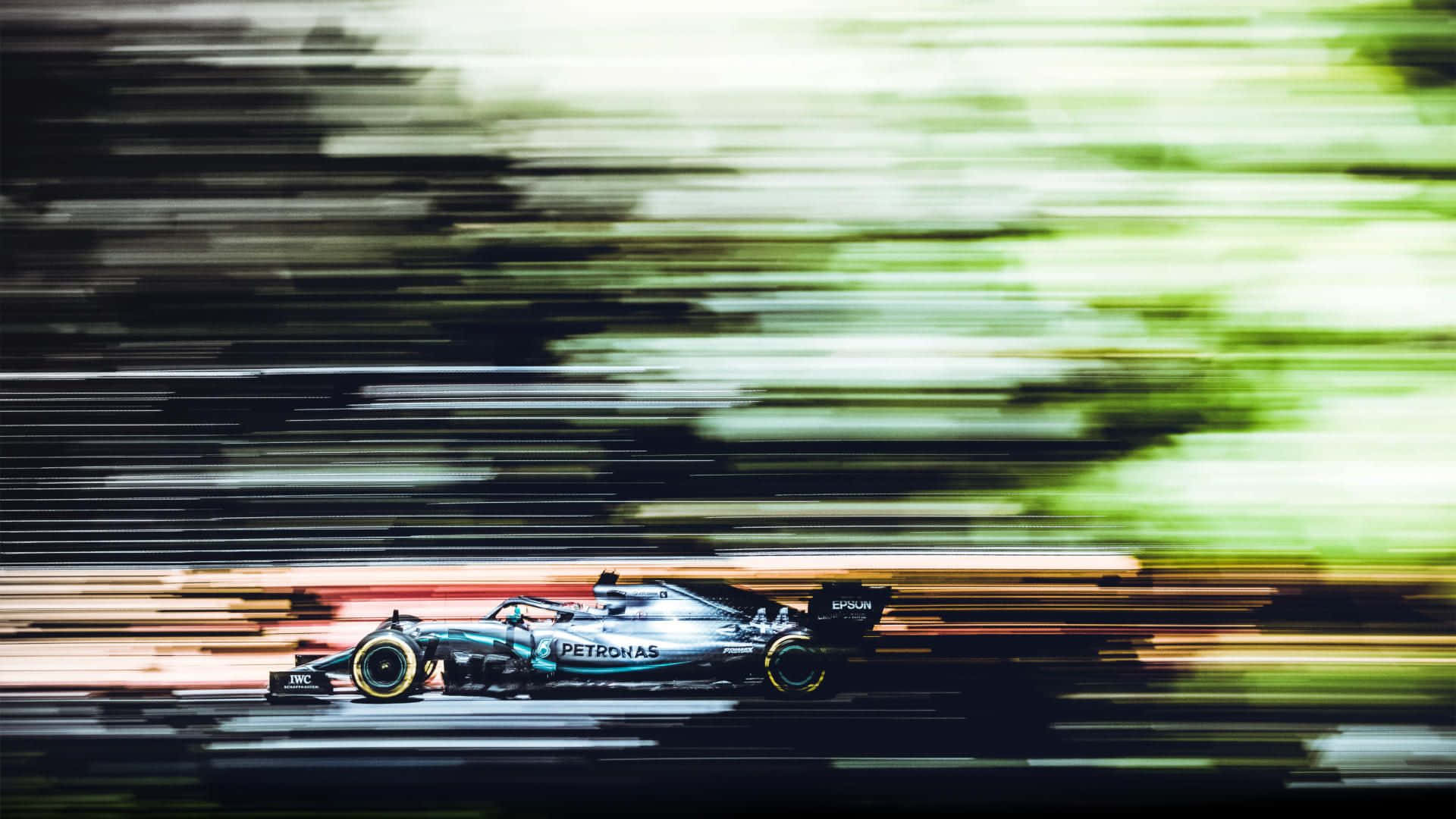A Blurry Image Of A Racing Car
