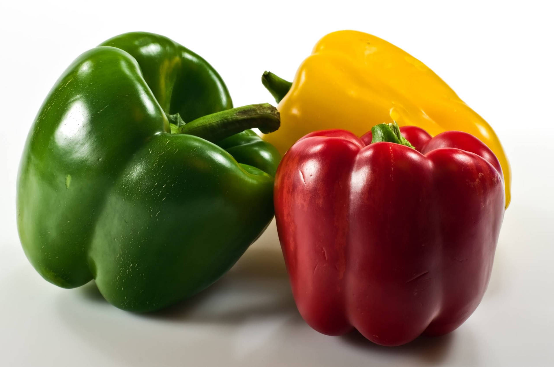 Download Radiant Green Red And Yellow Capsicum Fruits Wallpaper ...