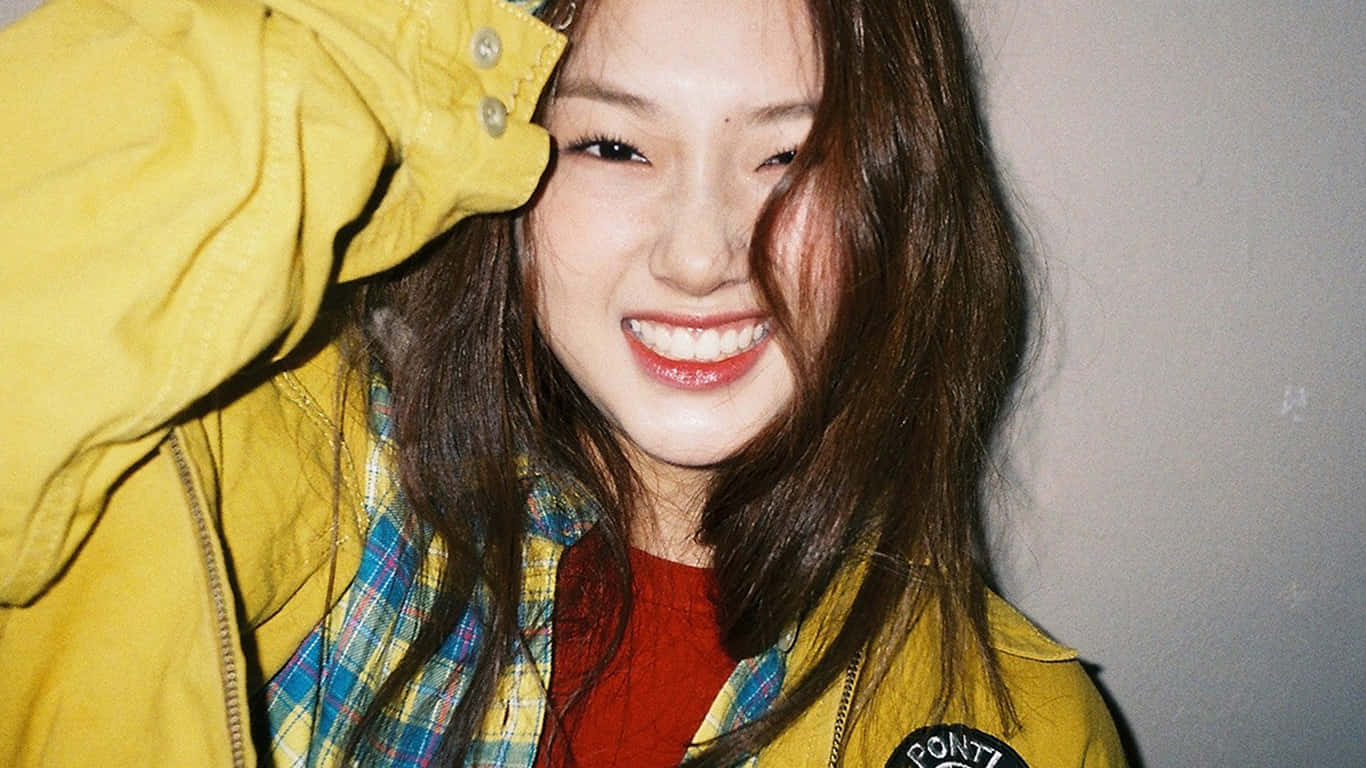 Radiant Smile Yellow Jacket Girl.jpg Wallpaper