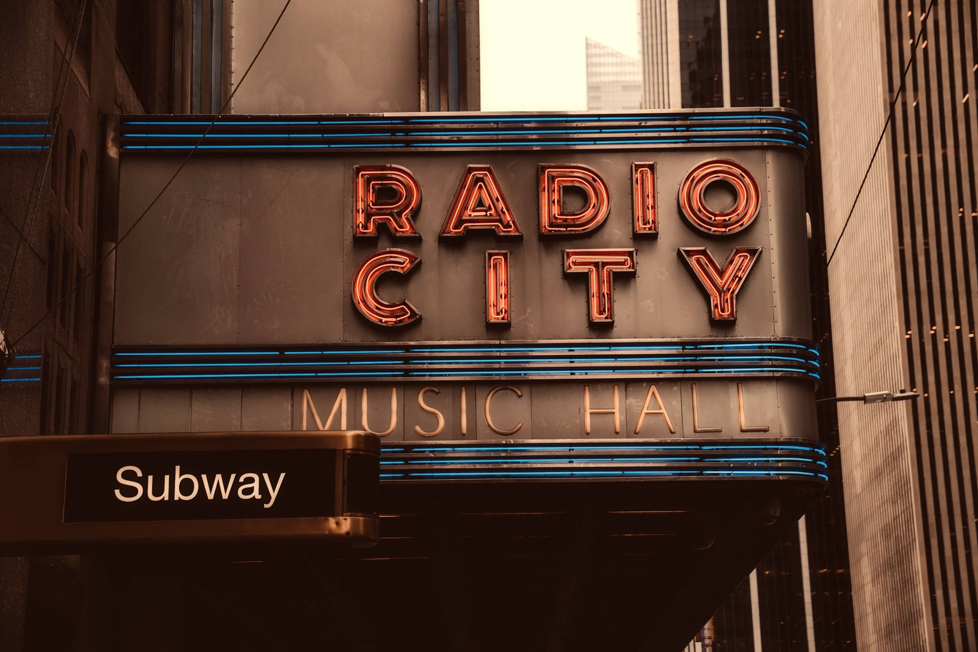 Radio City Neon Sign In Daylight Wallpaper