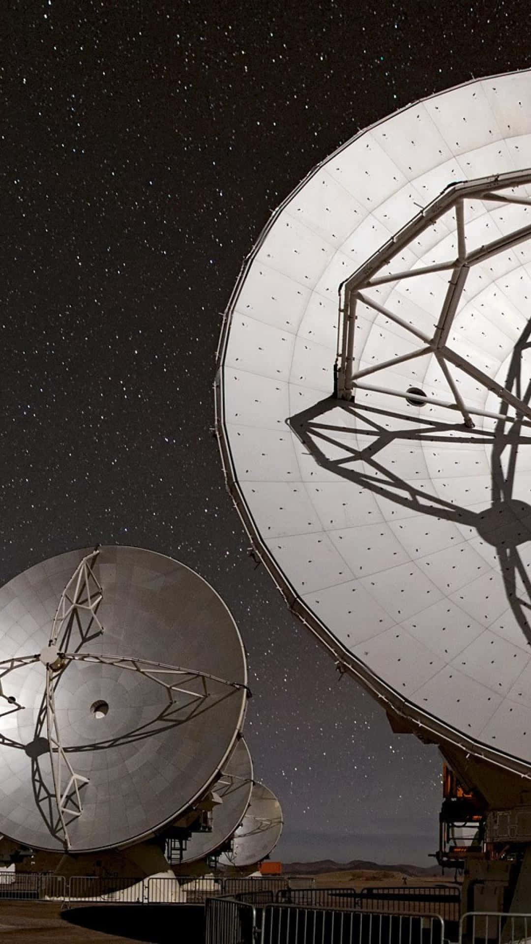 Majestic Radio Telescope on a Clear Night Sky Wallpaper