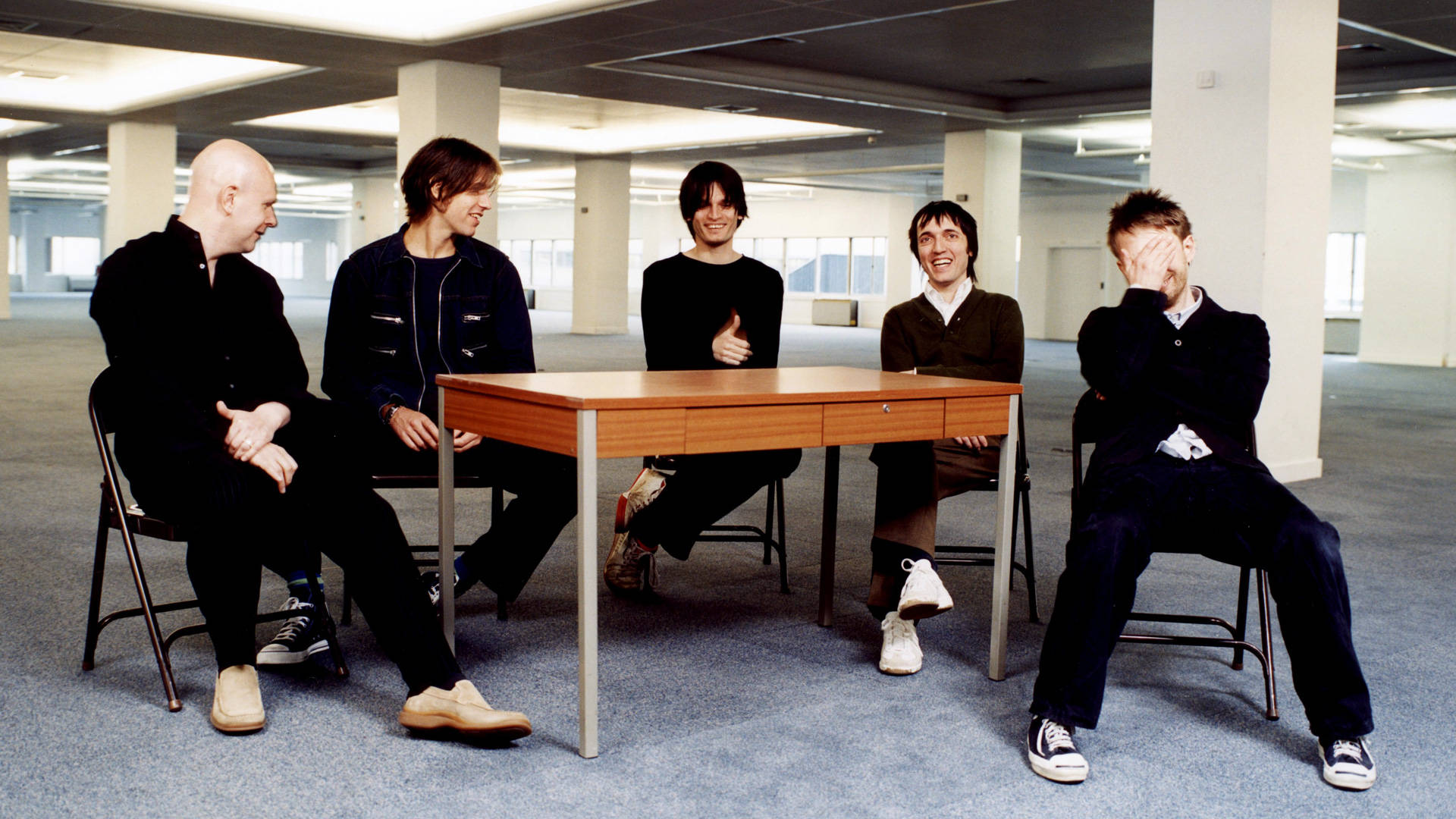 Radiohead Laughing Around A Table Wallpaper