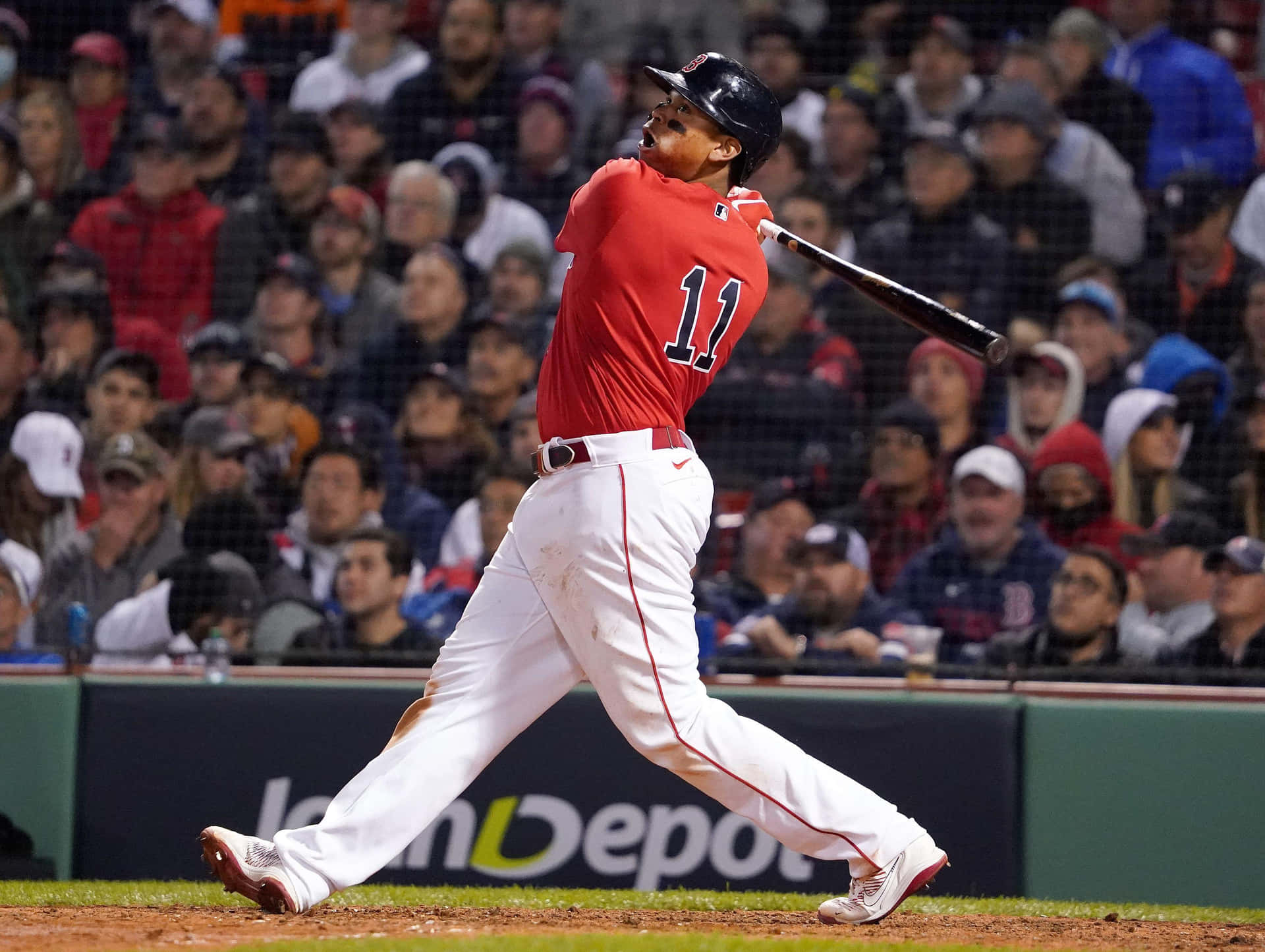 Rafael Devers Powerful Swing Red Sox Wallpaper