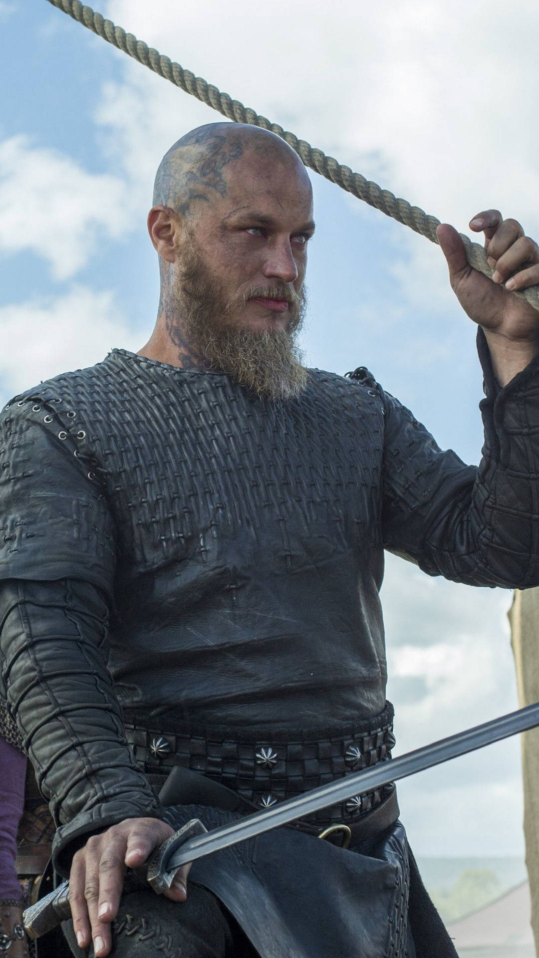 Download Ragnar Lothbrok 4k Vikings Wielding Sword Wallpaper | Wallpapers .com