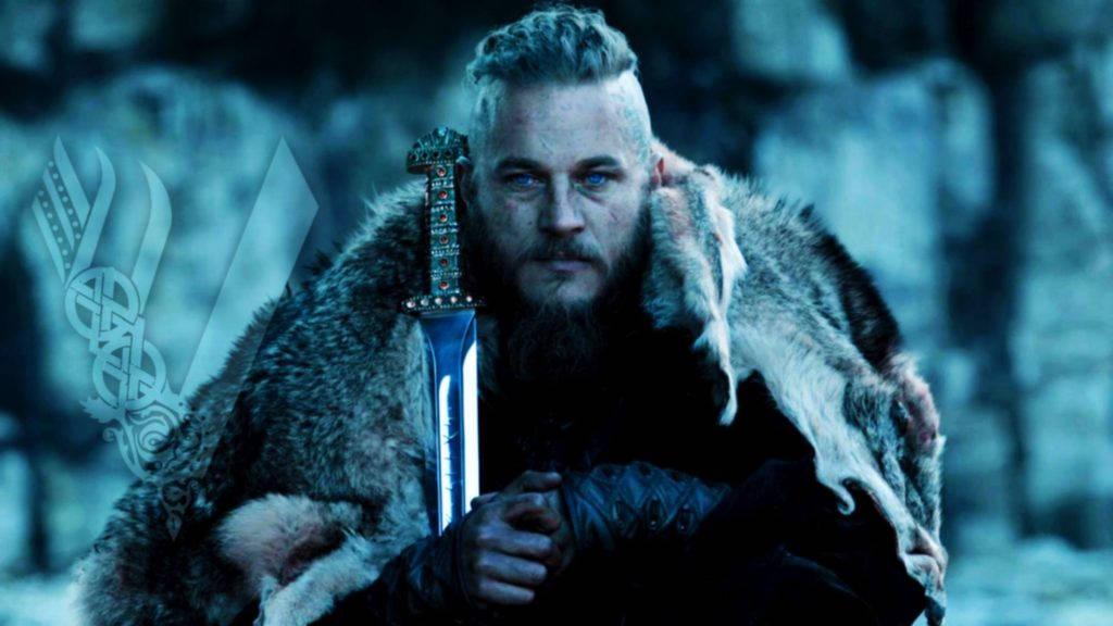 Wallpaper: Ragnar siddende med sværd Vikings Wallpaper. Wallpaper