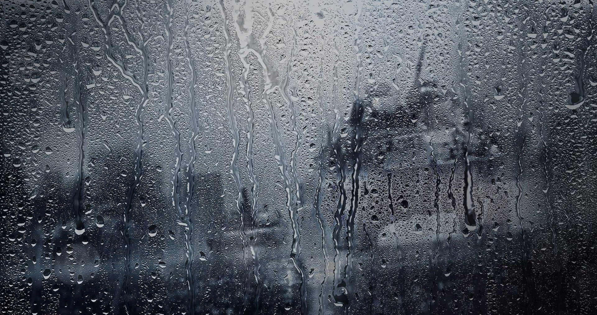 "Falling Drops: A beautiful picture of light rain in 4K resolution" Wallpaper