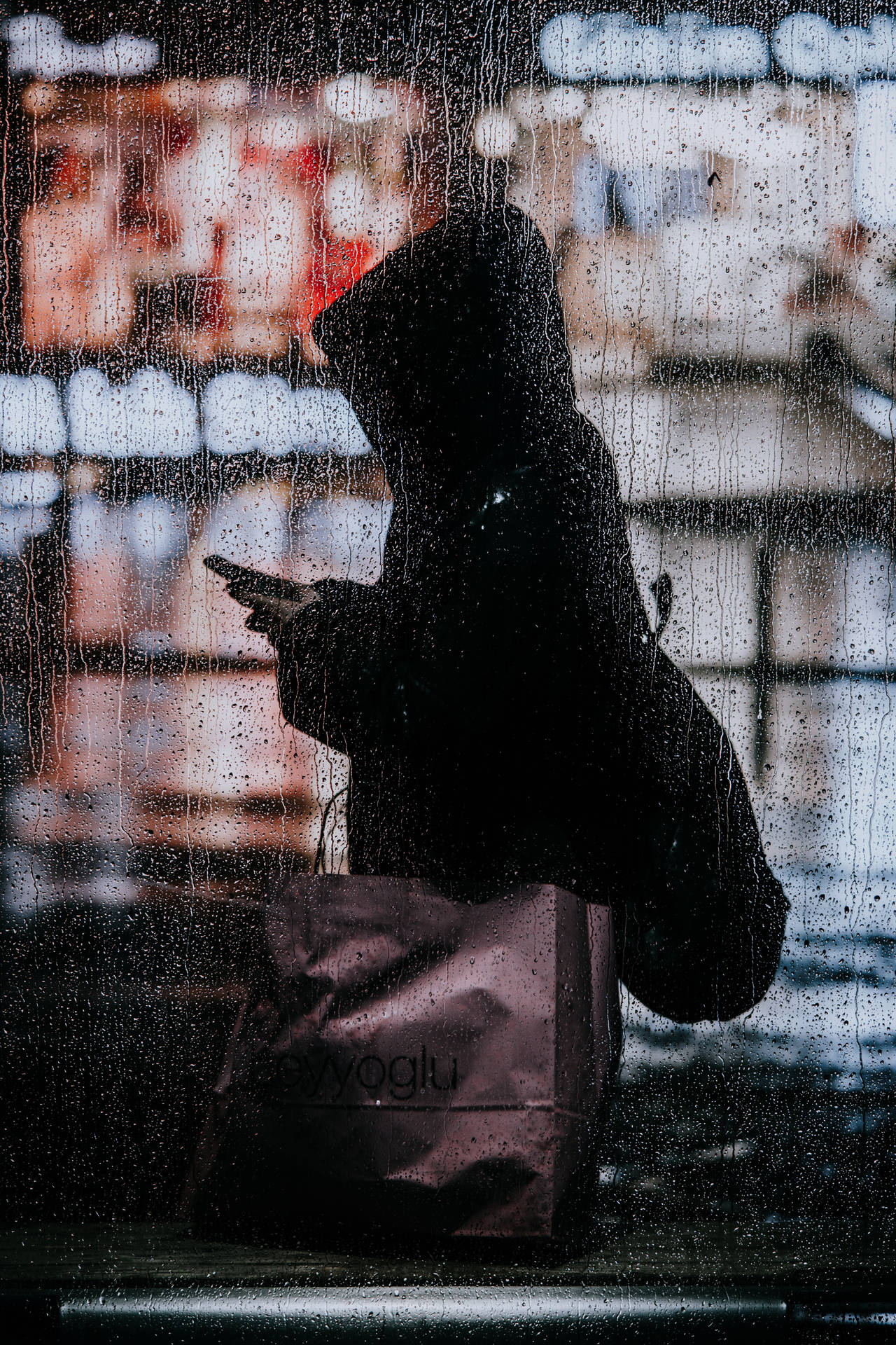 Young Woman Stepping out into a Rainy Day Wallpaper