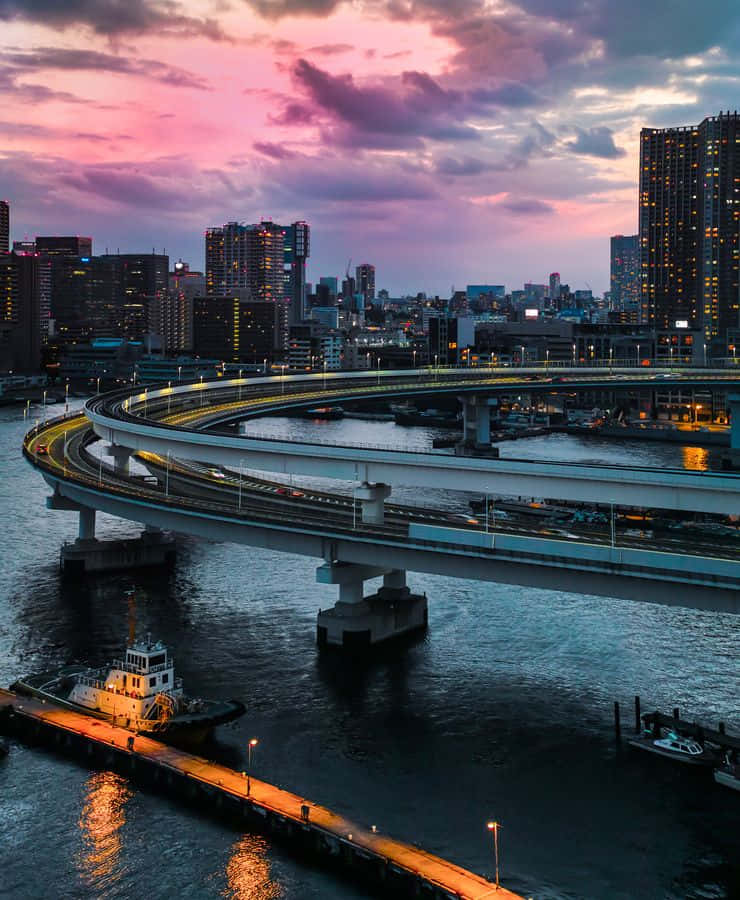 A vibrant shot of Rainbow Bridge in Odaiba, Tokyo