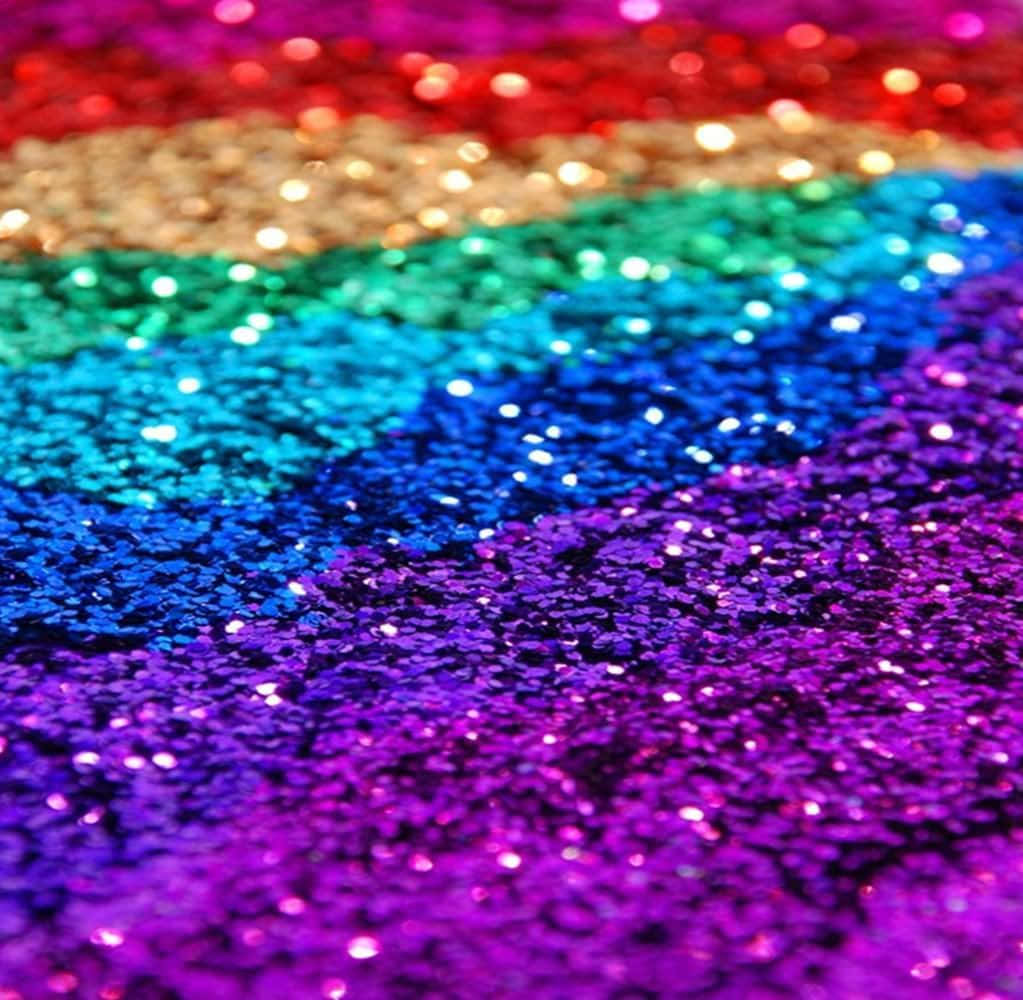 Feel the beauty and magic of a rainbow reflected in a glittery texture. Wallpaper