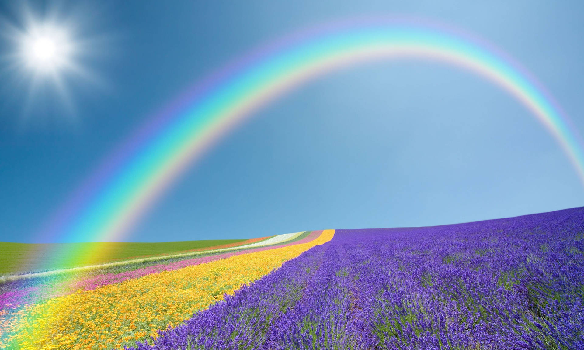 A peaceful view of a colourful rainbow in the sky Wallpaper