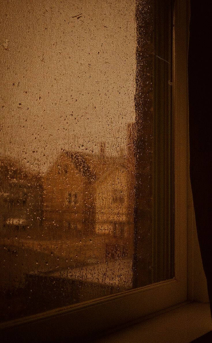 Raindrops On Window Dark Brown Aesthetic Wallpaper