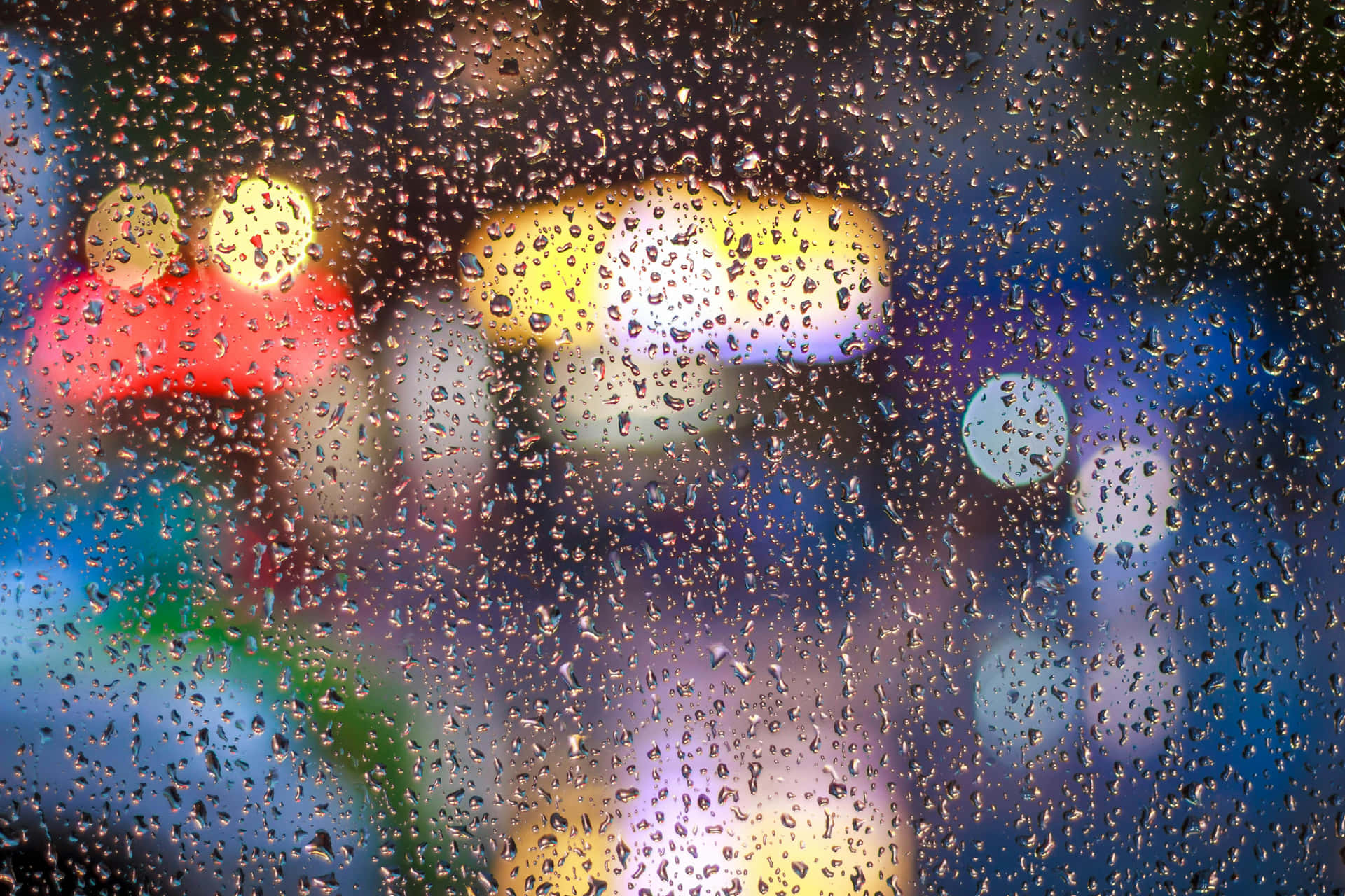 Raindrops_on_ Window_with_ Bokeh_ Lights_ Background Wallpaper