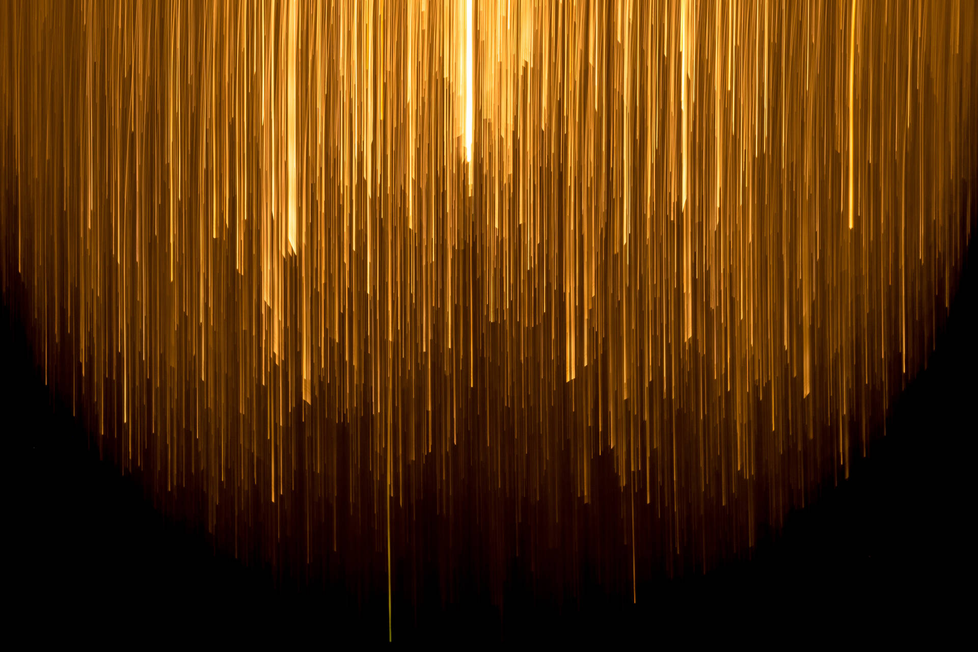 An ethereal image of a gold-colored rain on a glitchy backdrop Wallpaper