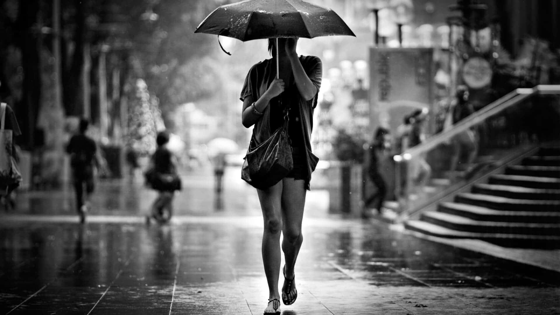 Woman With Umbrella On Rainy Day In Black And White Picture