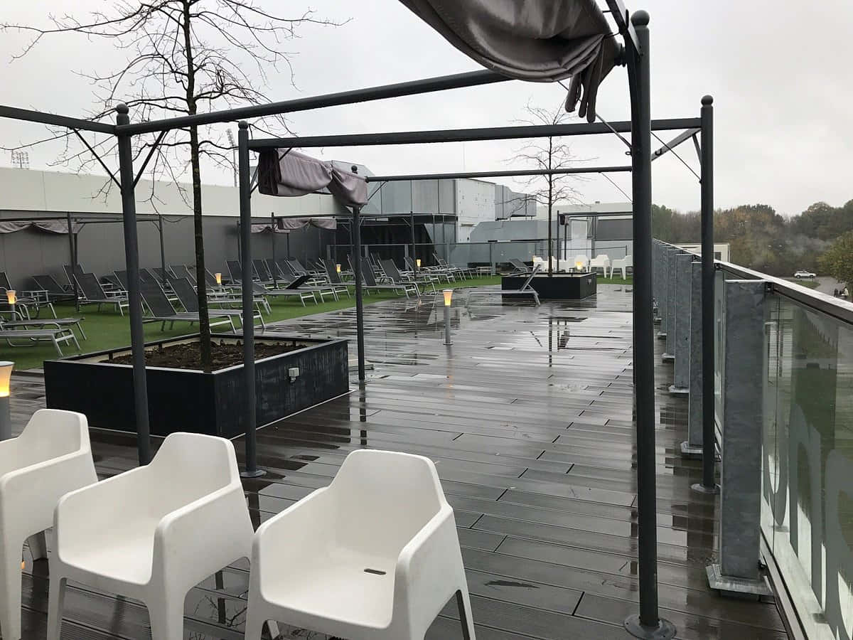 Rainy Outdoor Seating Area Sittard Wallpaper