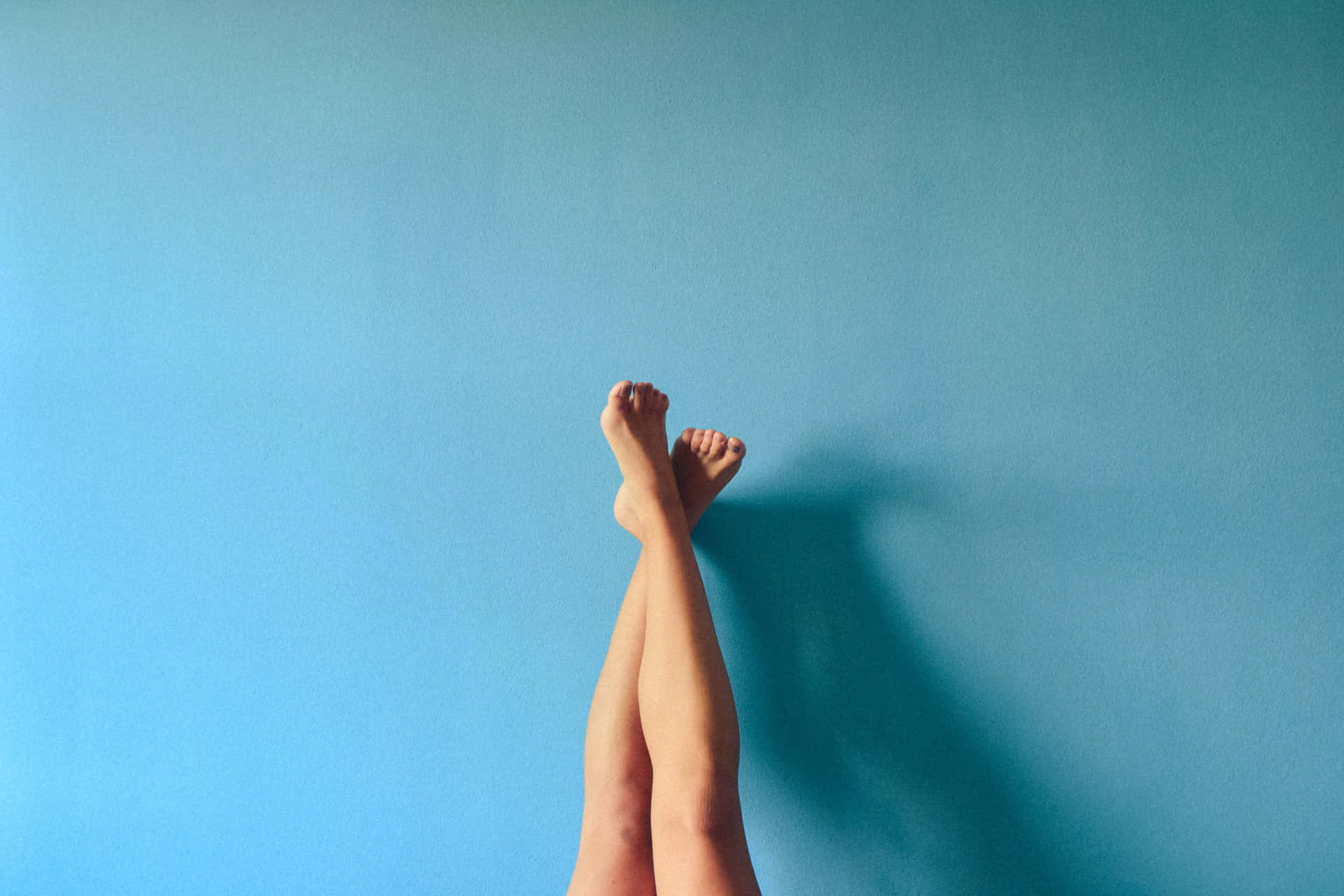 Serene Moments - Female Feet Crossed and Raised Wallpaper