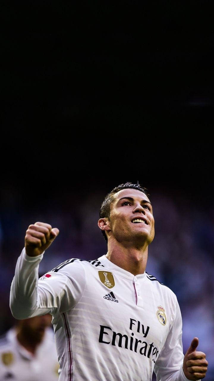 Raised Fist Cristiano Ronaldo iPhone Wallpaper: Wallpaper til iPhone med hævet næve Cristiano Ronaldo. Wallpaper