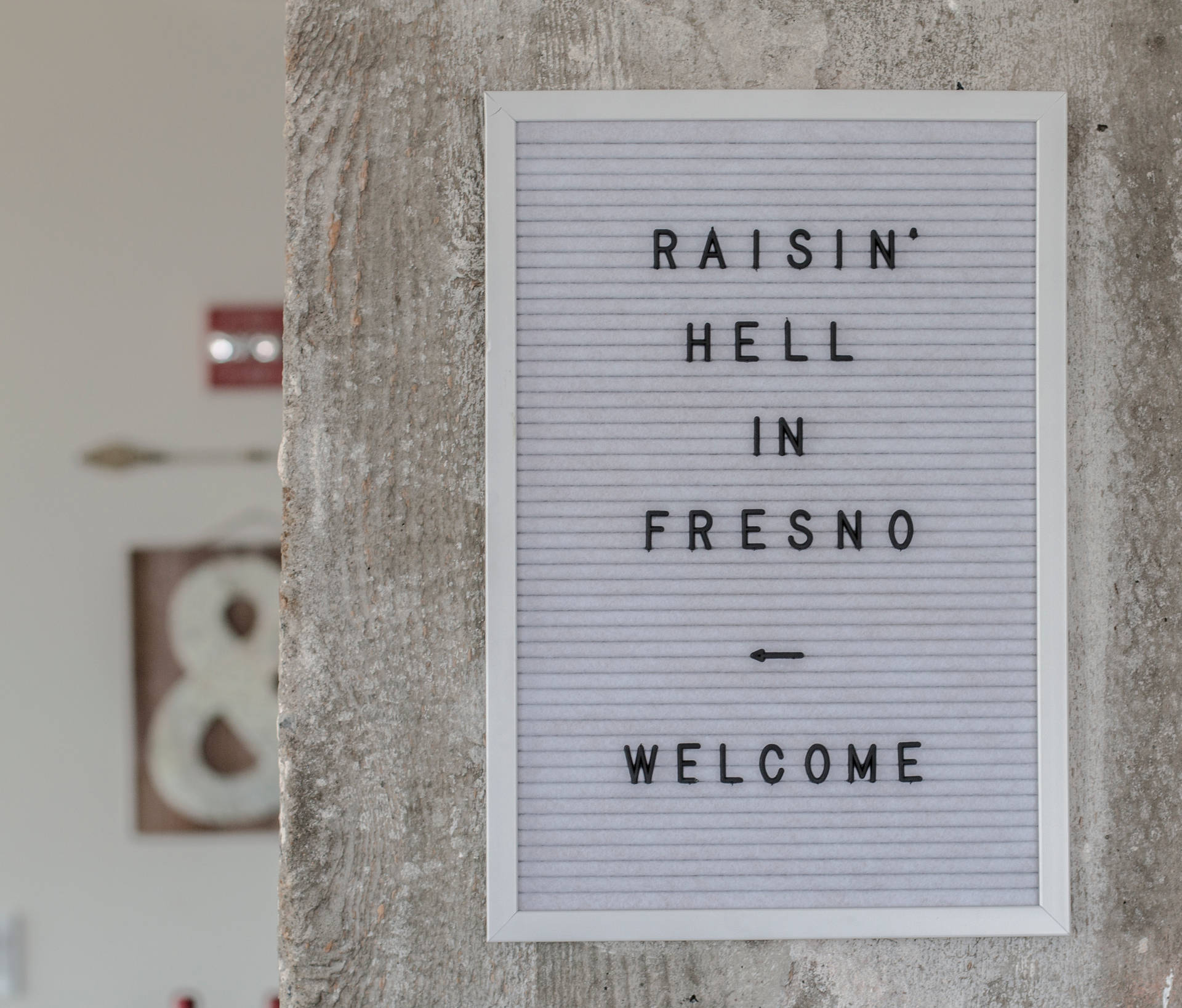 Raisin Hell In Fresno Sign Wallpaper