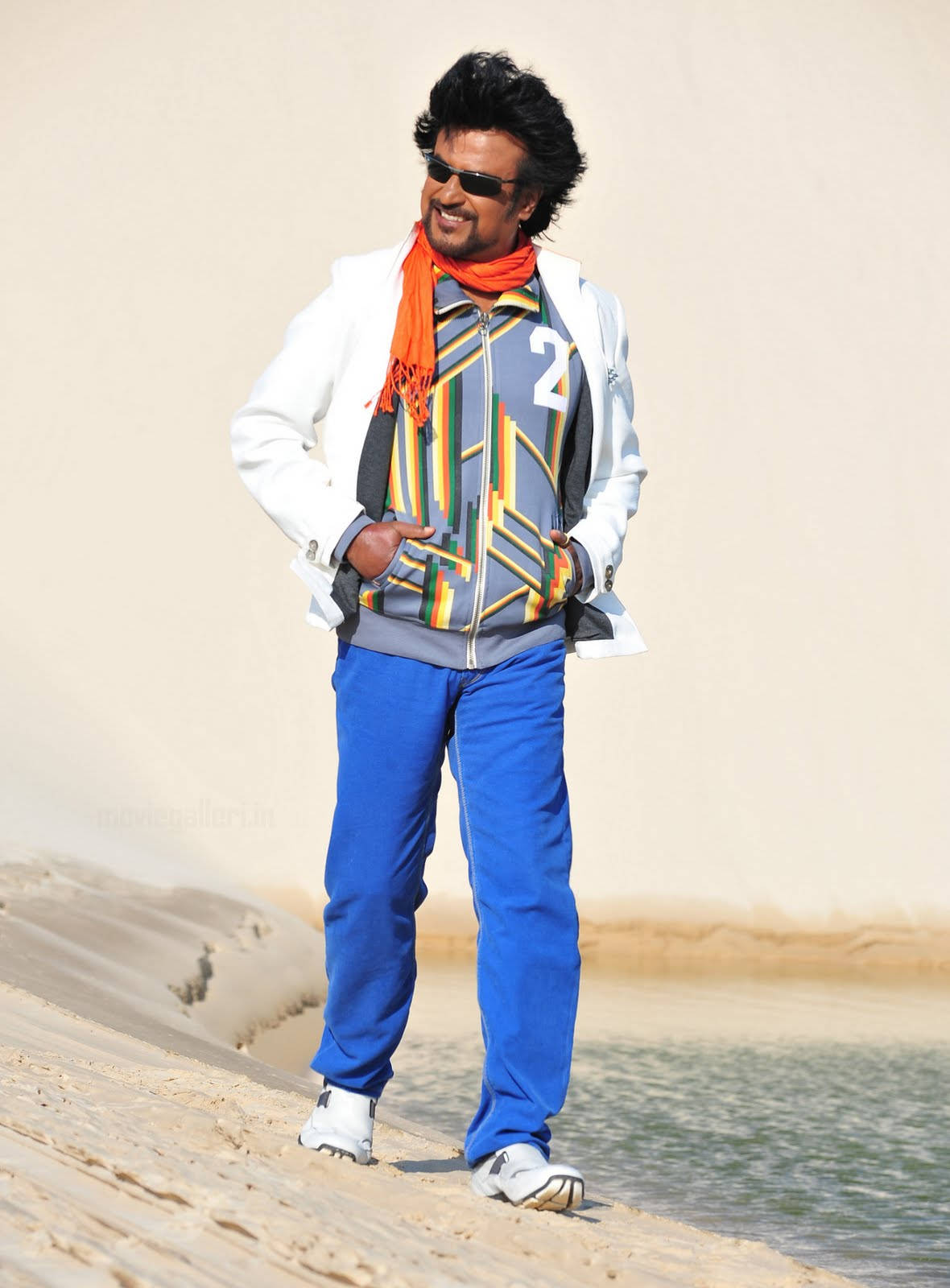 Rajinikanth Walking On Dune Slope Background