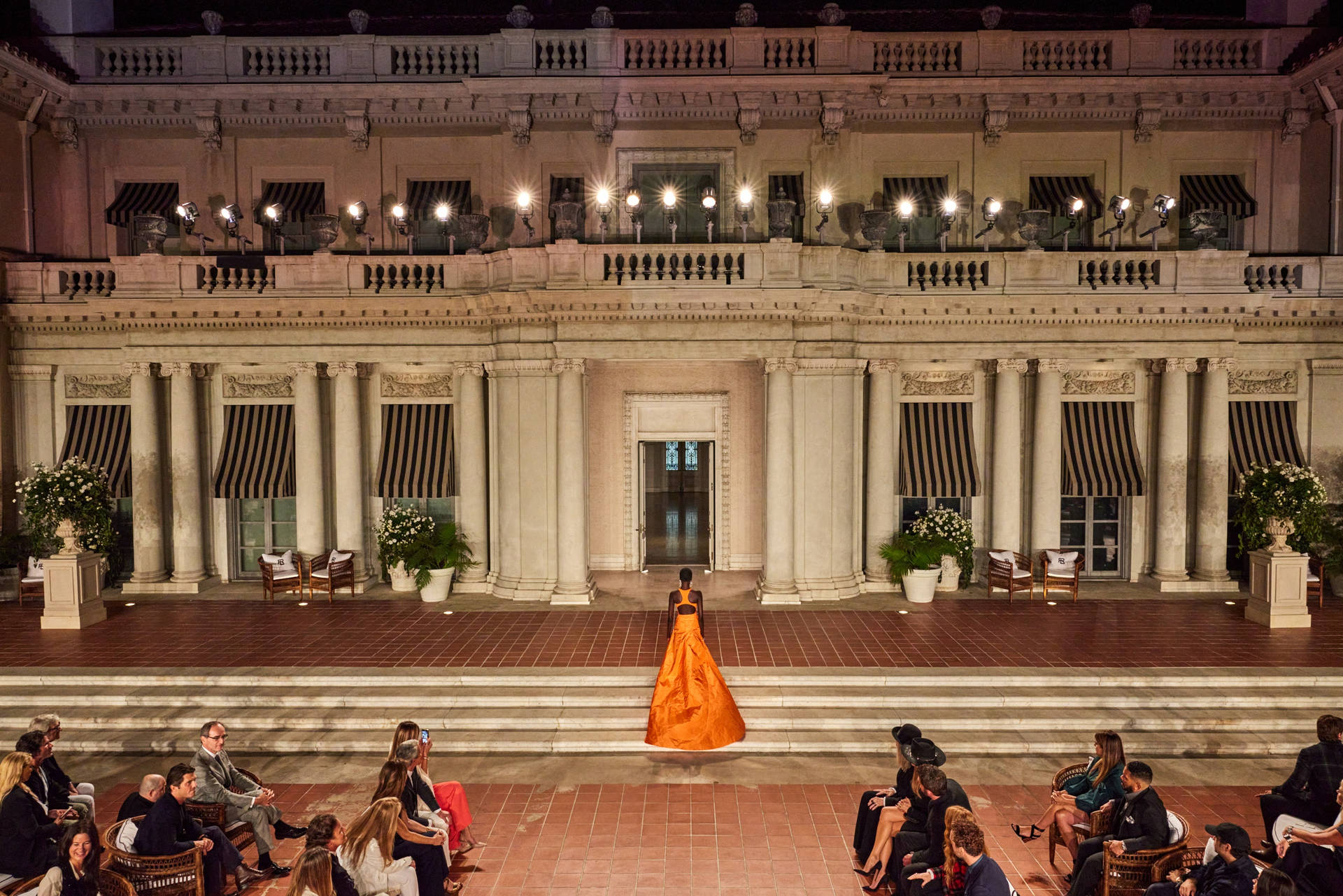Elegant Woman in Ralph Lauren Orange Dress Wallpaper