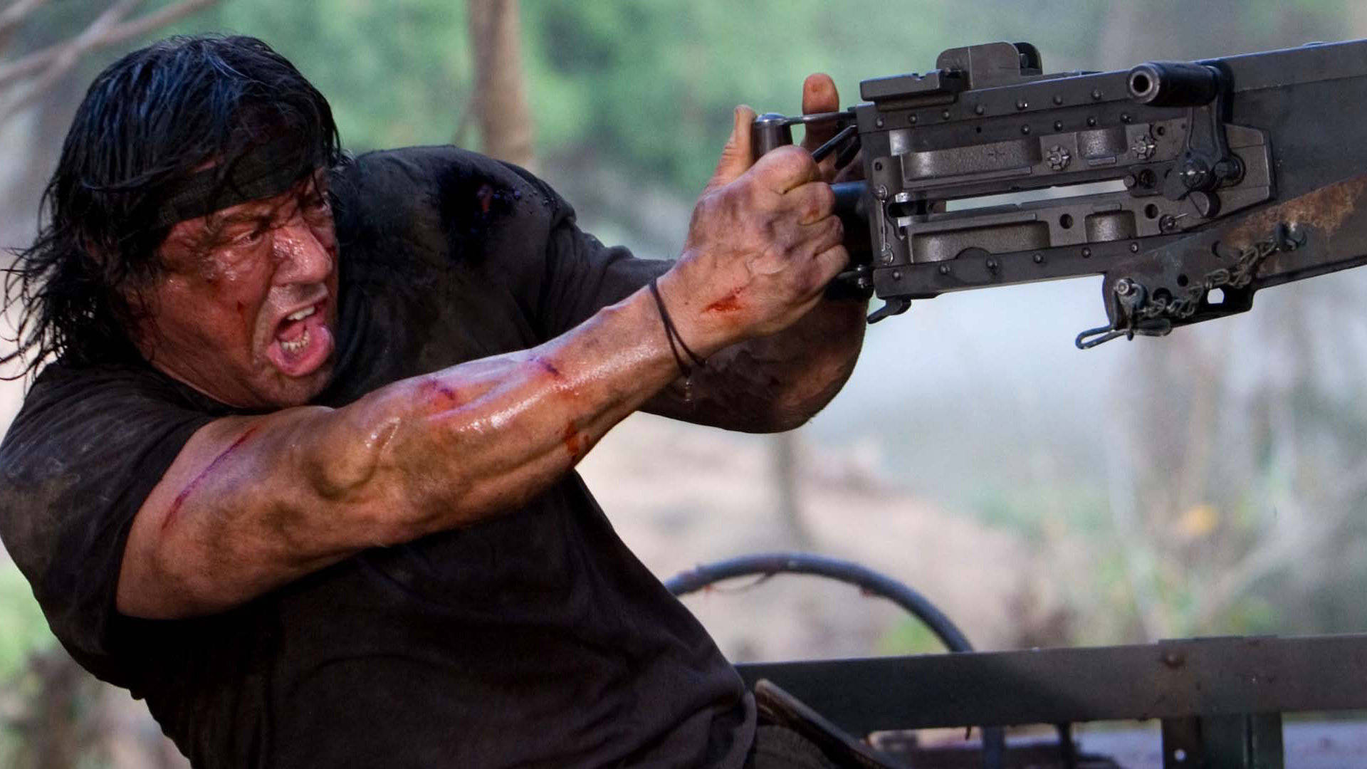 Rambo Behind The Gun Wallpaper