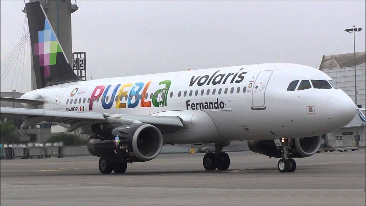 Caption: Volaris Aircraft ready for takeoff Wallpaper