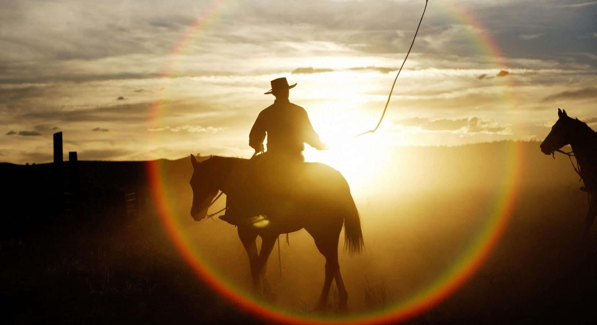 Two Cowboys Riding Horses In The Sunset Wallpaper