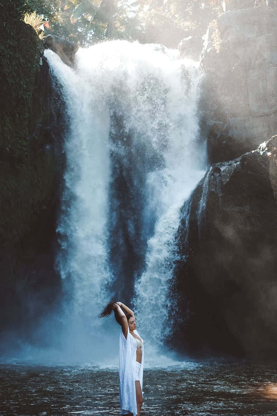 Random Person Bathing In Waterfall Wallpaper