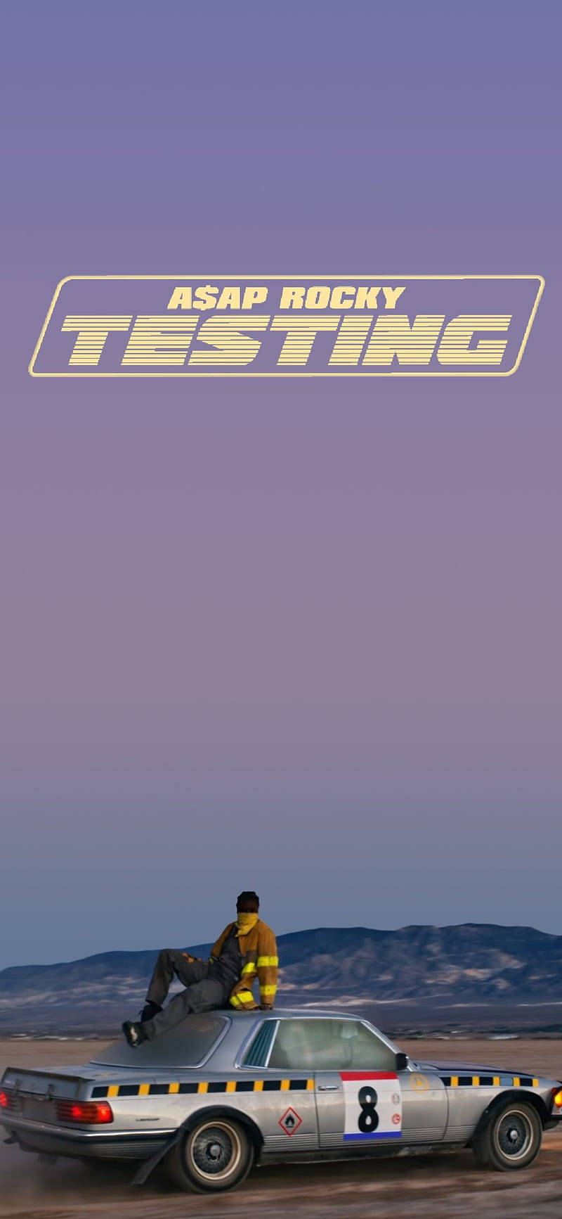 a man is sitting on top of a car with the words testing Wallpaper