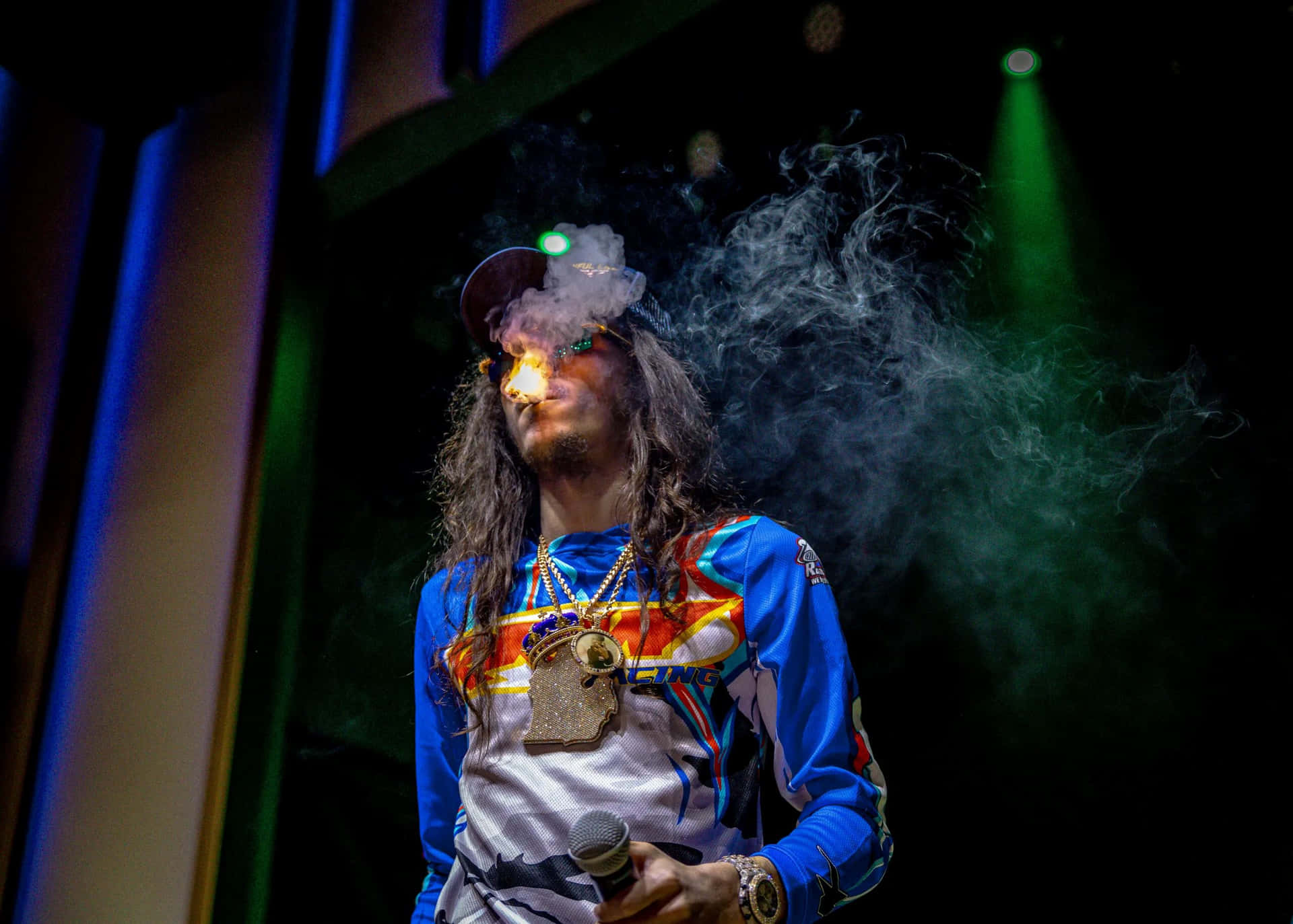 Rapper Exhaling Smokeon Stage Wallpaper