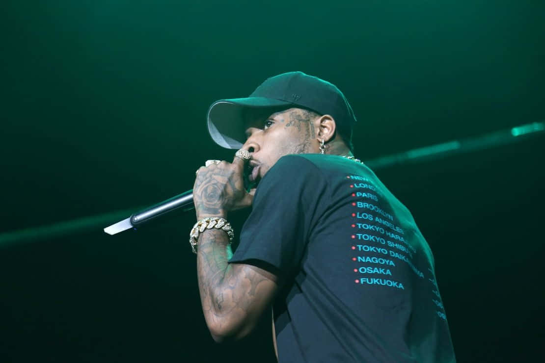 Rapper Performance Green Backdrop Wallpaper