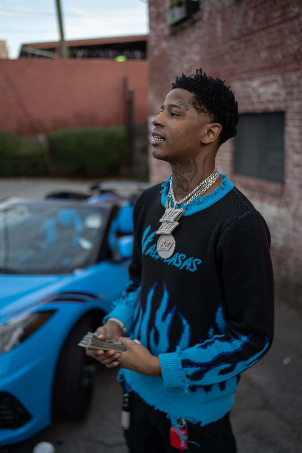 Rapper_with_ Blue_ Sports_ Car_and_ Money Wallpaper