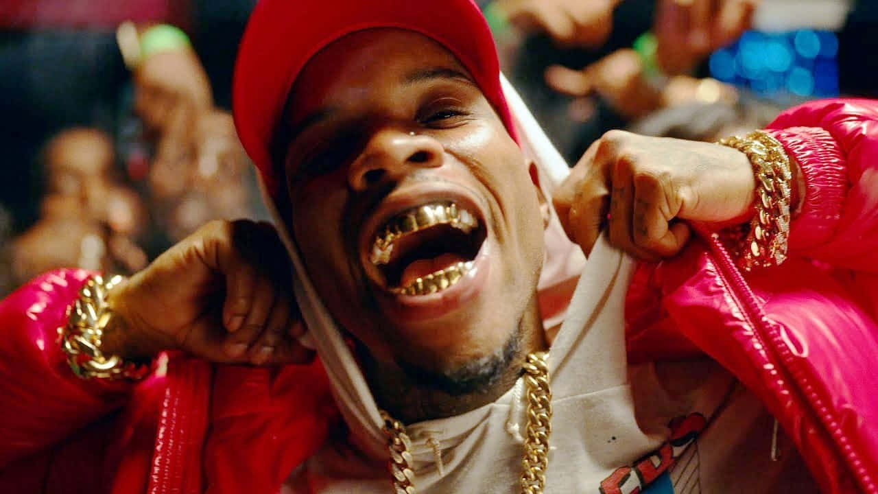 Rapper_with_ Gold_ Grill_and_ Red_ Cap.jpg Wallpaper