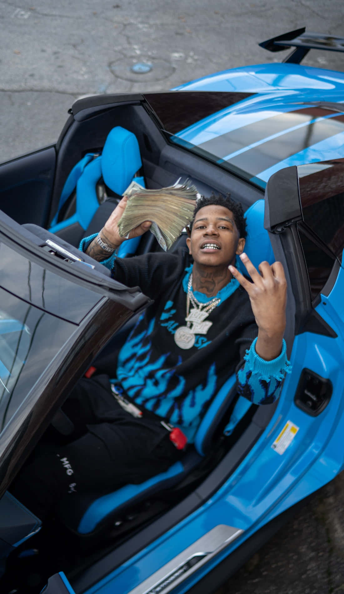 Rapperin Blue Sports Car With Money Wallpaper