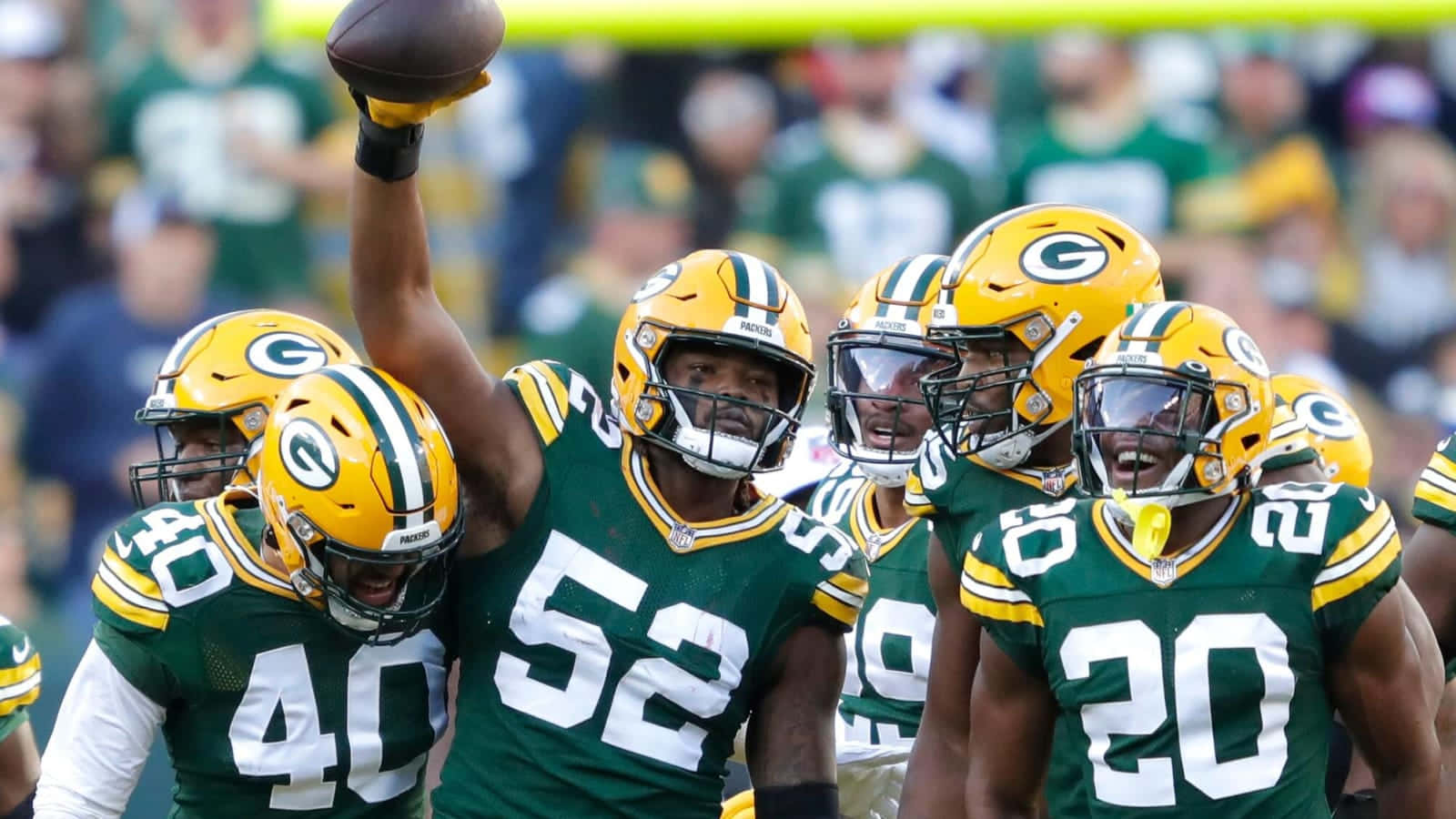 Rashan Gary Celebrationwith Green Bay Packers Teammates Wallpaper