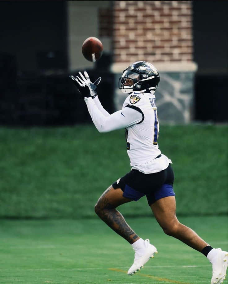 Rashod Bateman Catching Football Practice Wallpaper