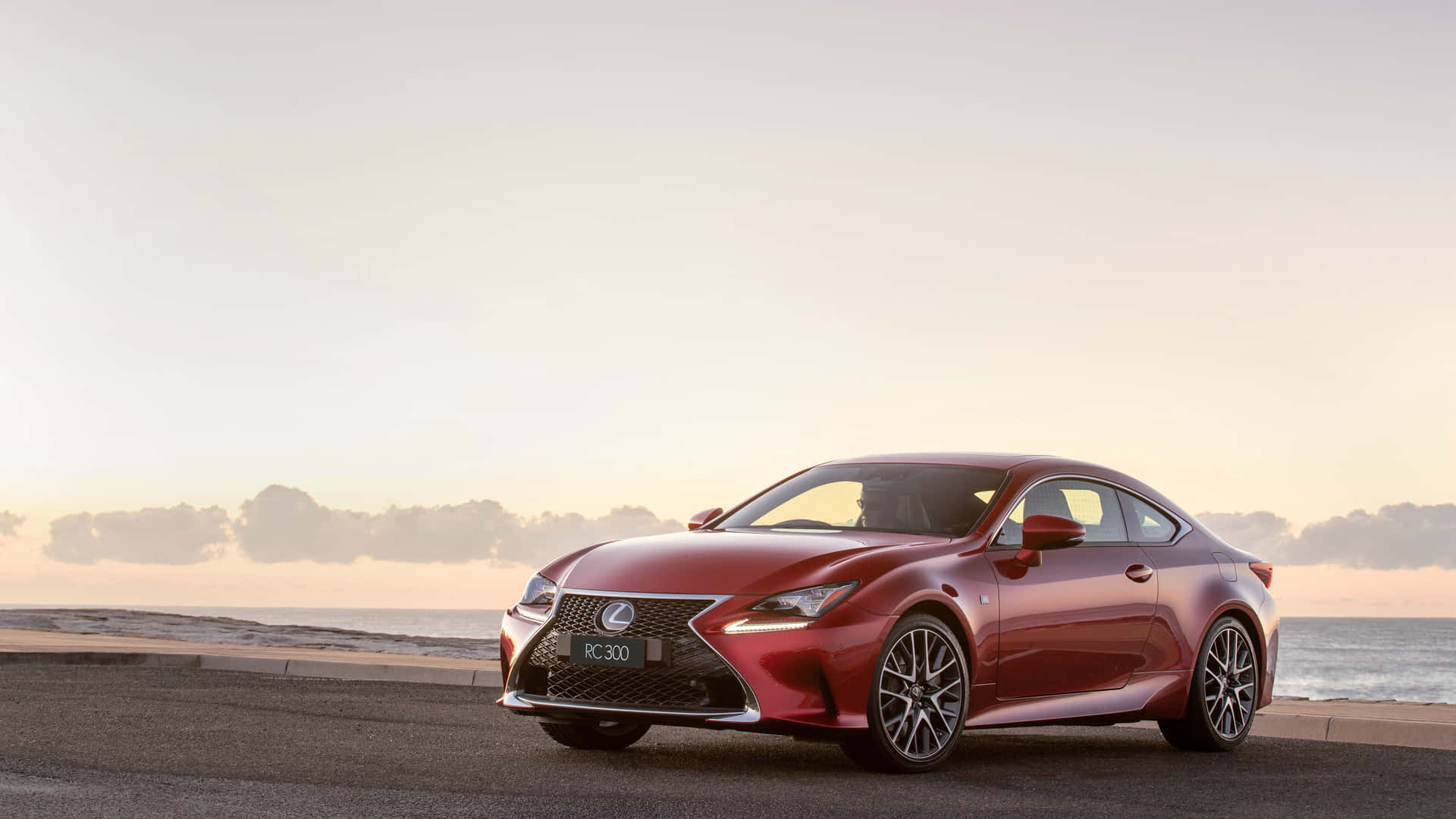 The Red Lexus Rc - F Coupe Is Parked On The Beach Wallpaper