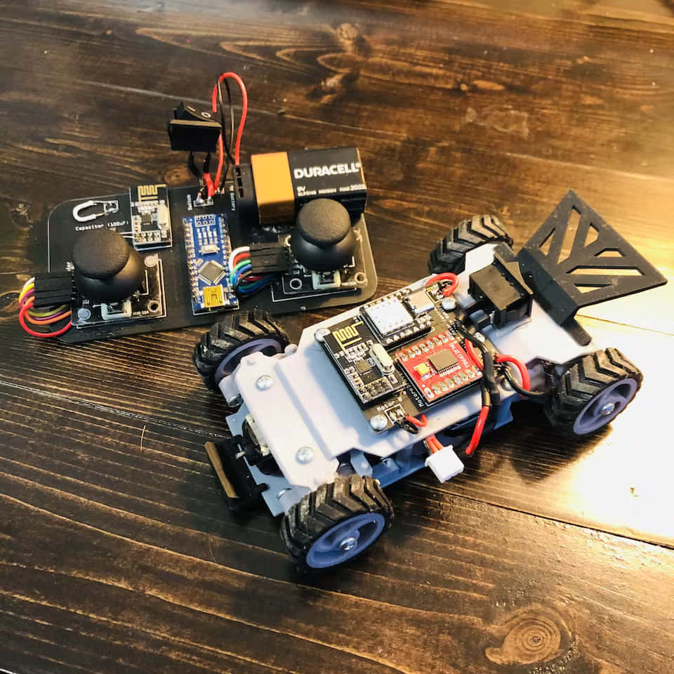 A Toy Car With A Remote Control And Electronics
