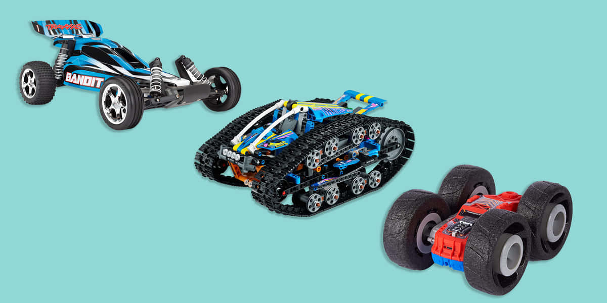 Three Toy Cars On A Blue Background