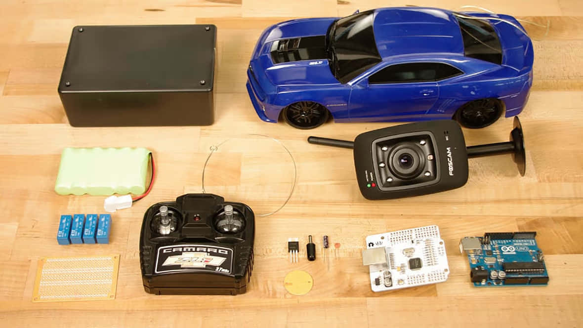 A Blue Car With A Remote Control And Other Electronics