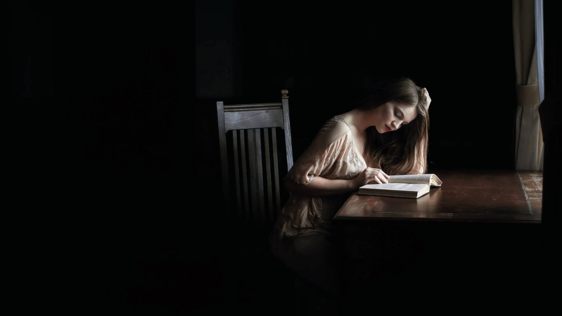 Reading Woman In Dark Room Wallpaper