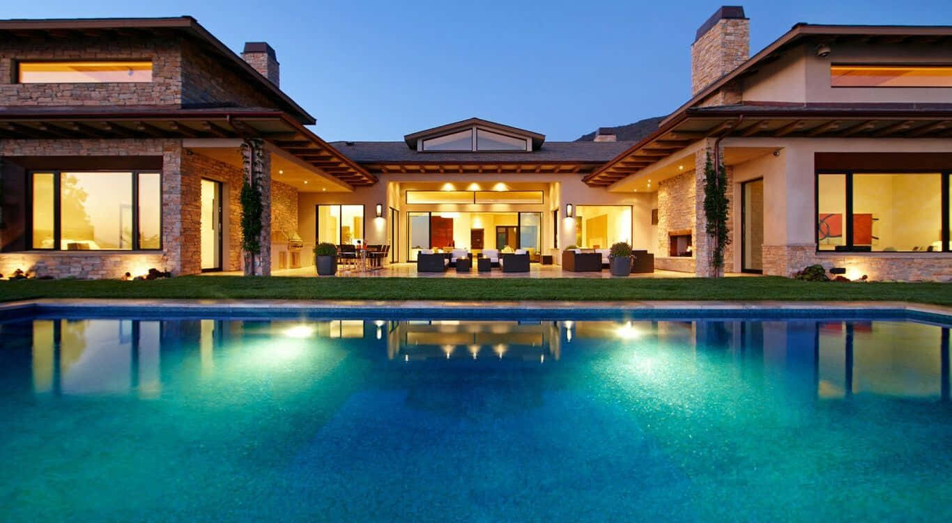 A Large House With A Pool And A Large Yard
