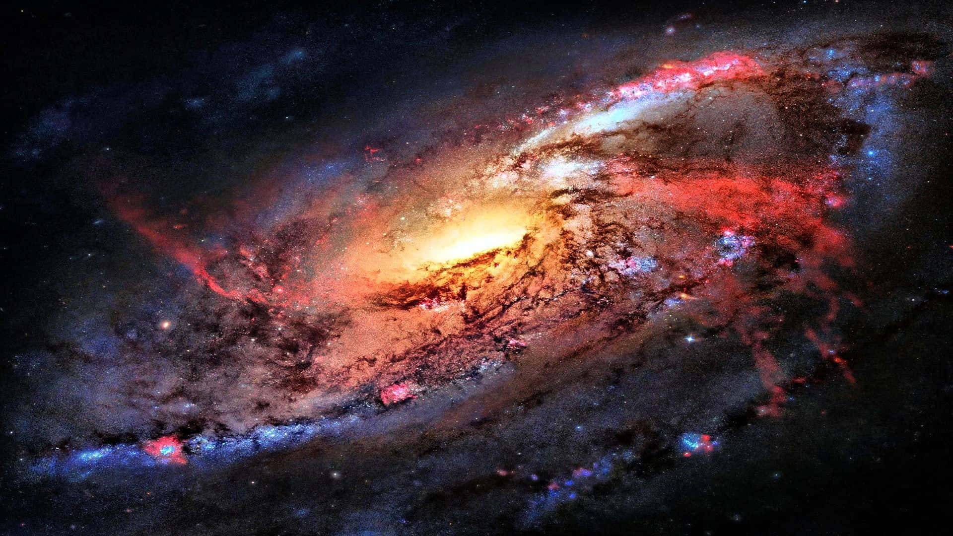 A Spiral Galaxy In Space With Red And Blue Lights