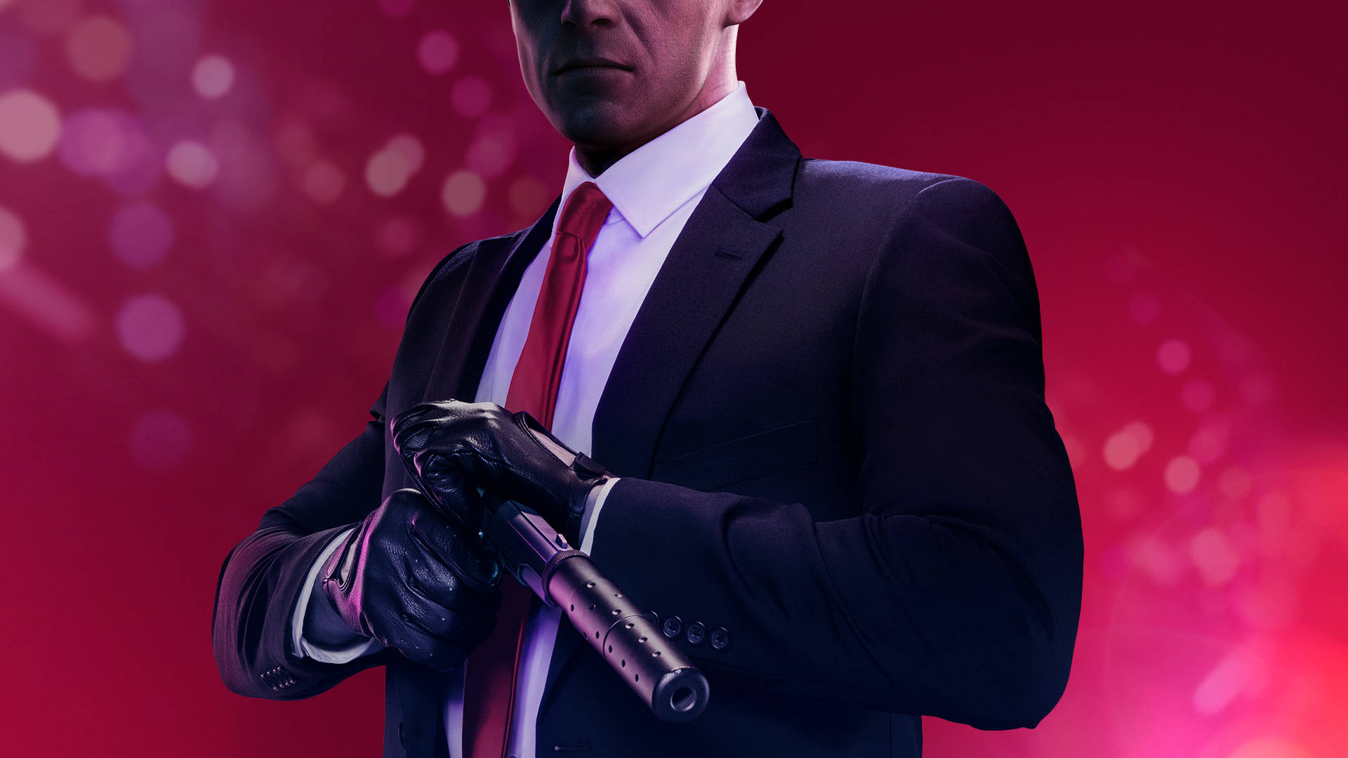 A Man In A Suit Holding A Gun Wallpaper